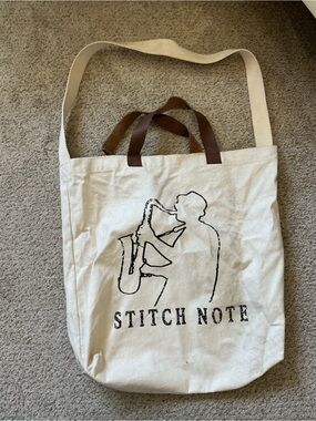 Stitch Note Cream Canvas Tote with Black Saxophone Print and Brown Handles